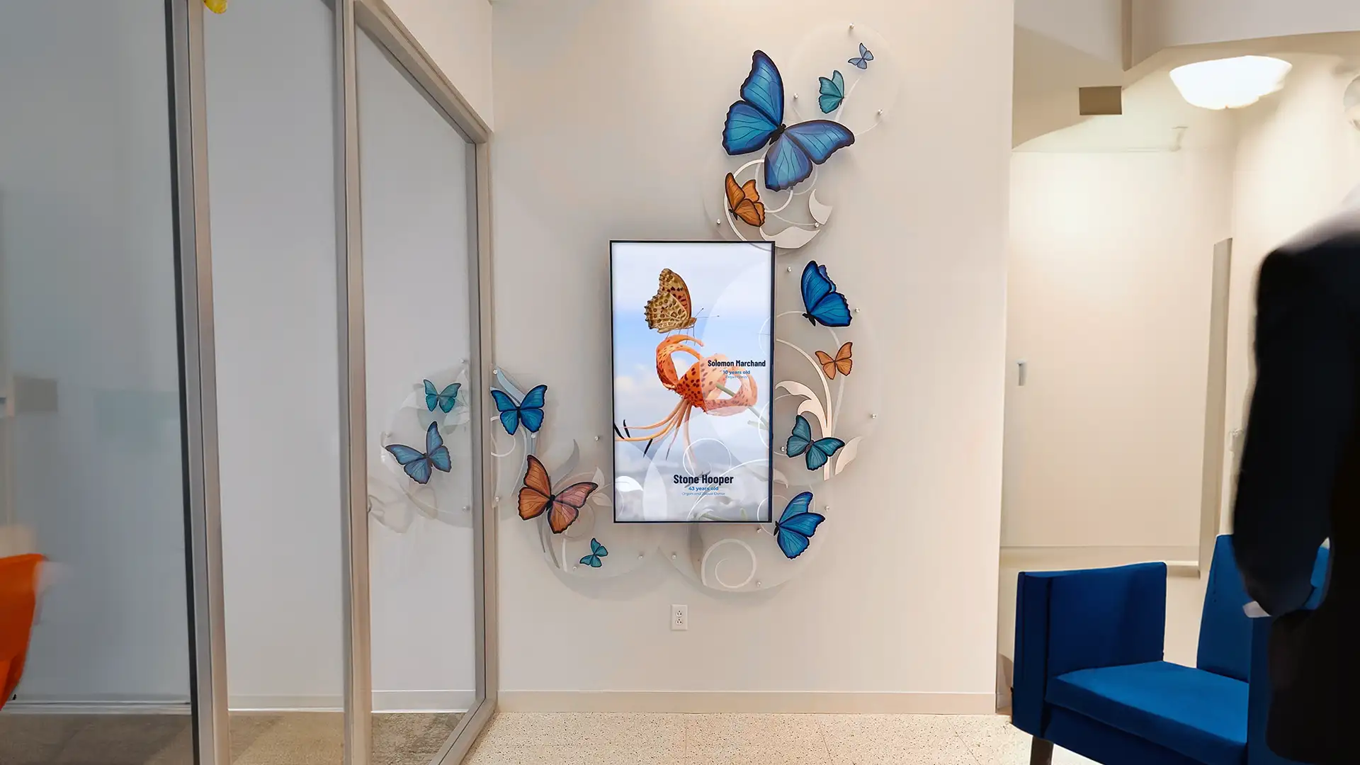 Digital Recognition Donor Wall With Custom Printed Plexiglas Graphics and surround. Interactive Display to read about donors, programs and recognize all donations made to the clinic.